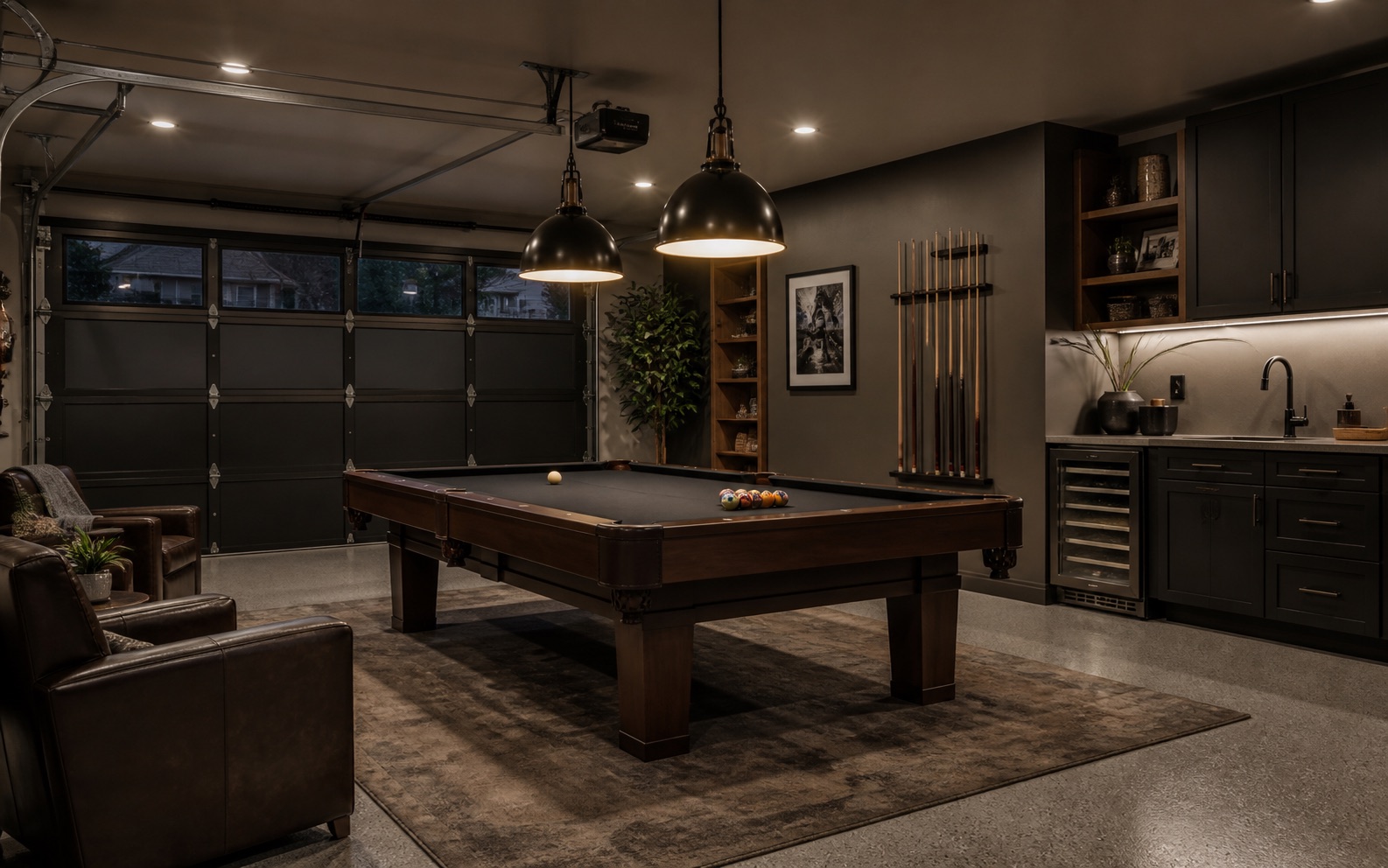 Finished garage billiards lounge with cabinetry and garage door