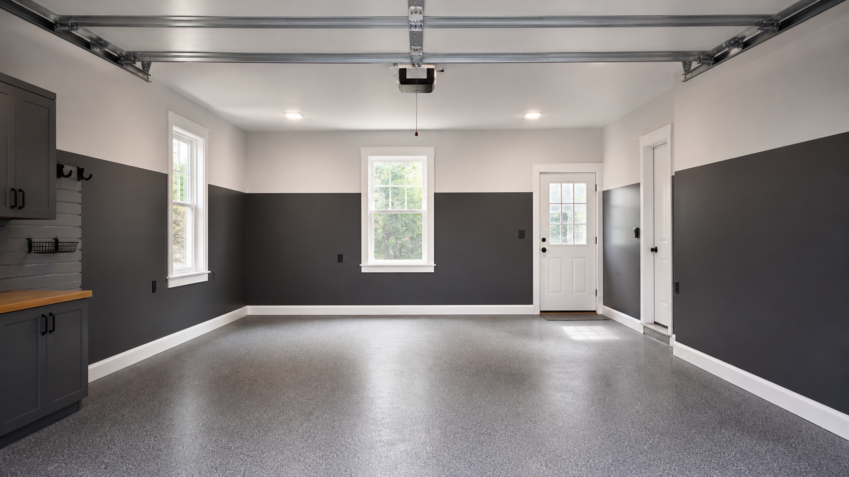 Finished Greater Boston garage with charcoal lower walls, warm-white upper walls, clean ceiling, and crisp white trim