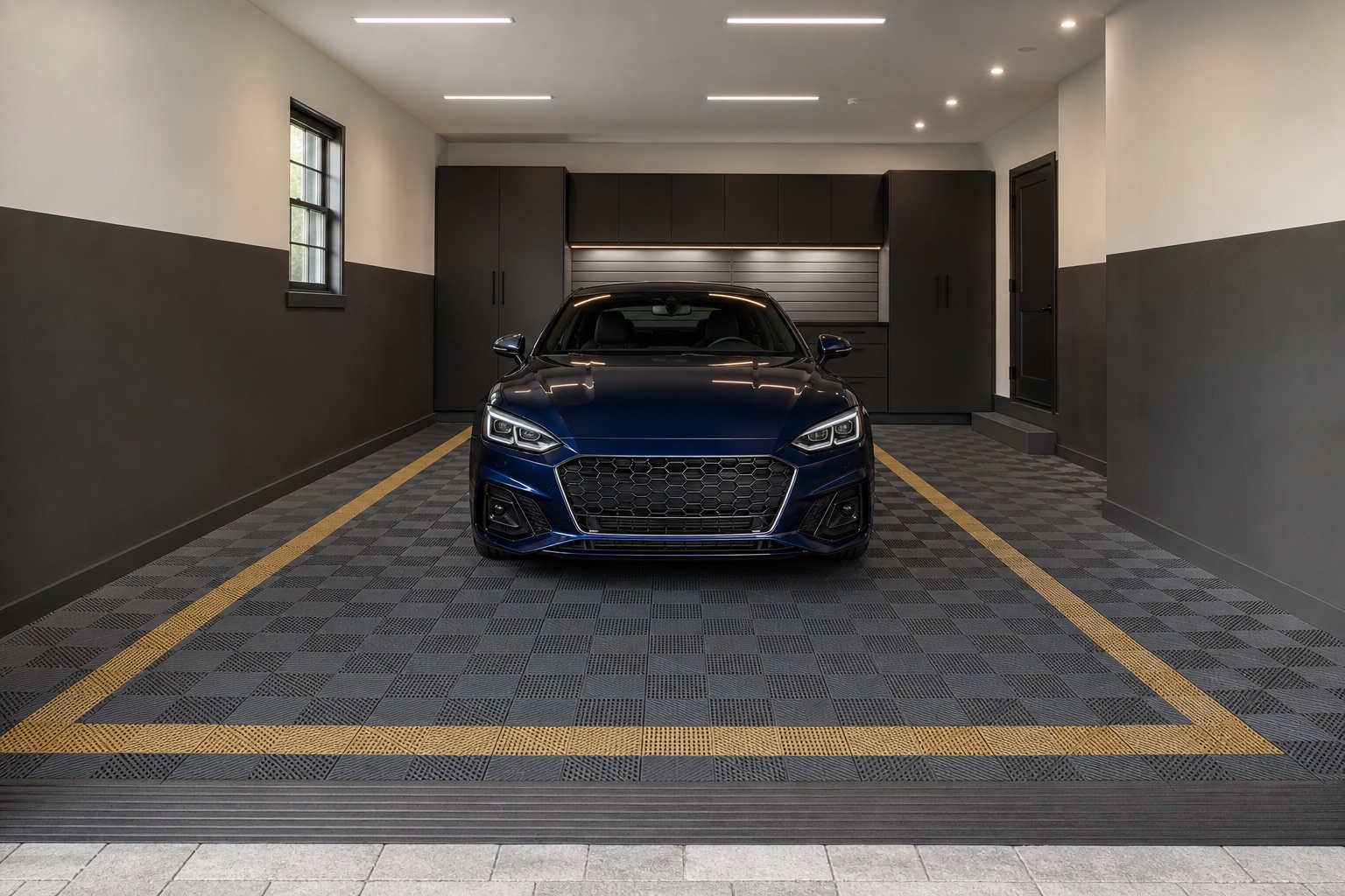Finished residential garage with dark modular floor tiles and a coordinated gold parking datum